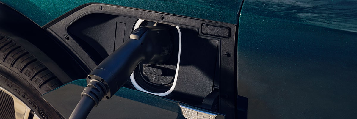 Close up view of a 2025 Cadillac LYRIQ being EV charged.