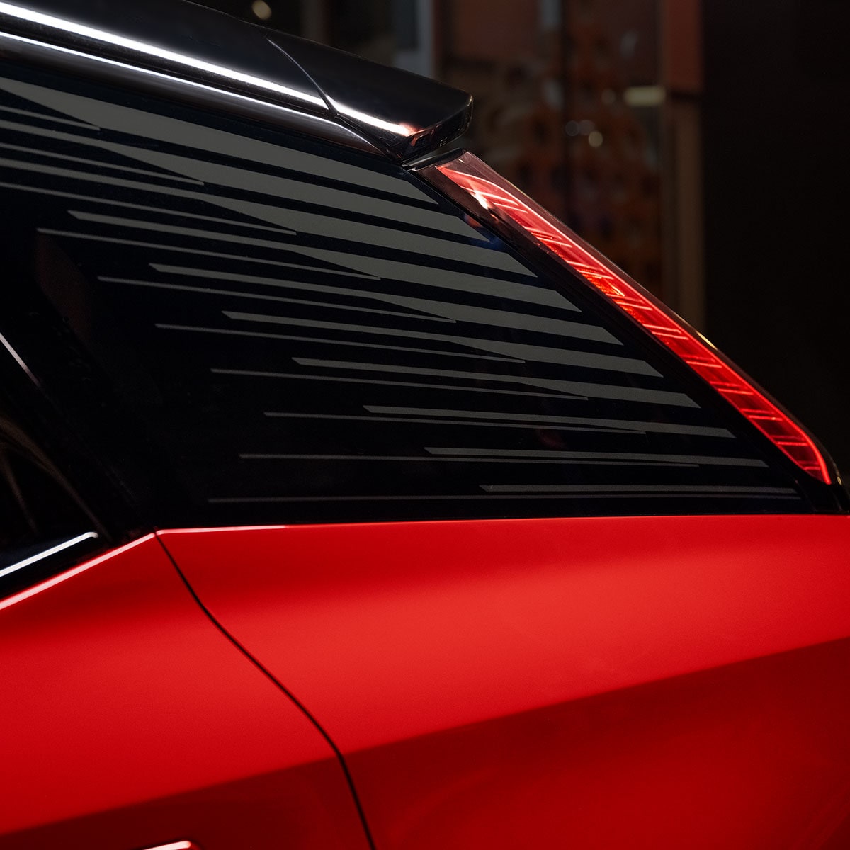 Close up view of the rear window accents on the 2025 Cadillac OPTIQ electric SUV.