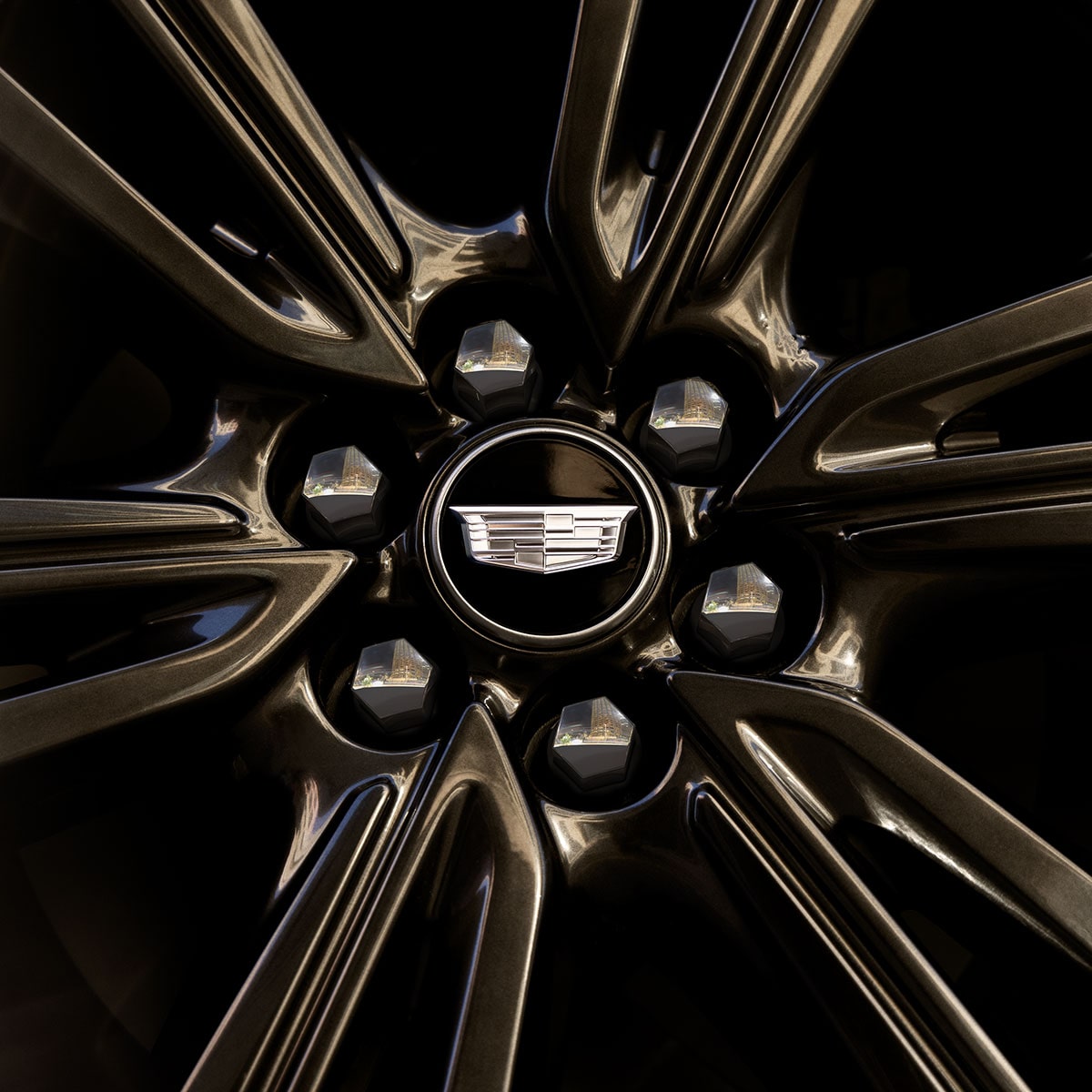 Close up shot of the alloy wheel on the 2025 Cadillac OPTIQ electric SUV.