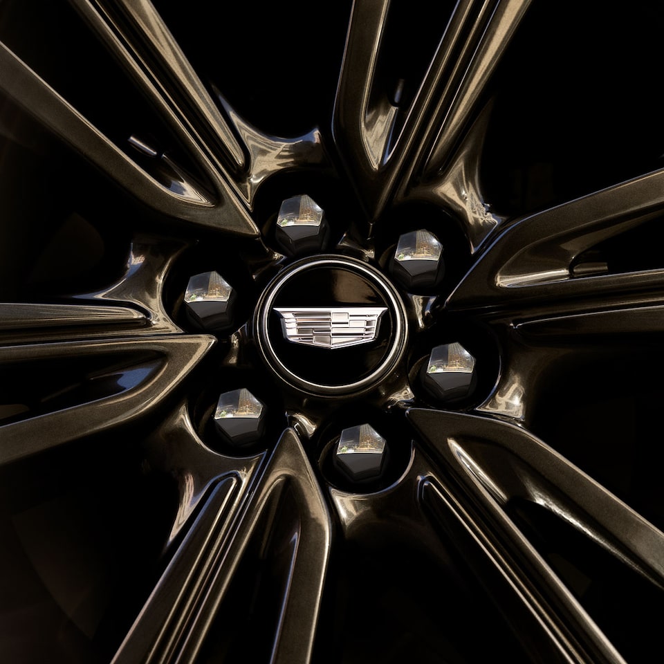Close up shot of the alloy wheel on the 2025 Cadillac OPTIQ electric SUV.