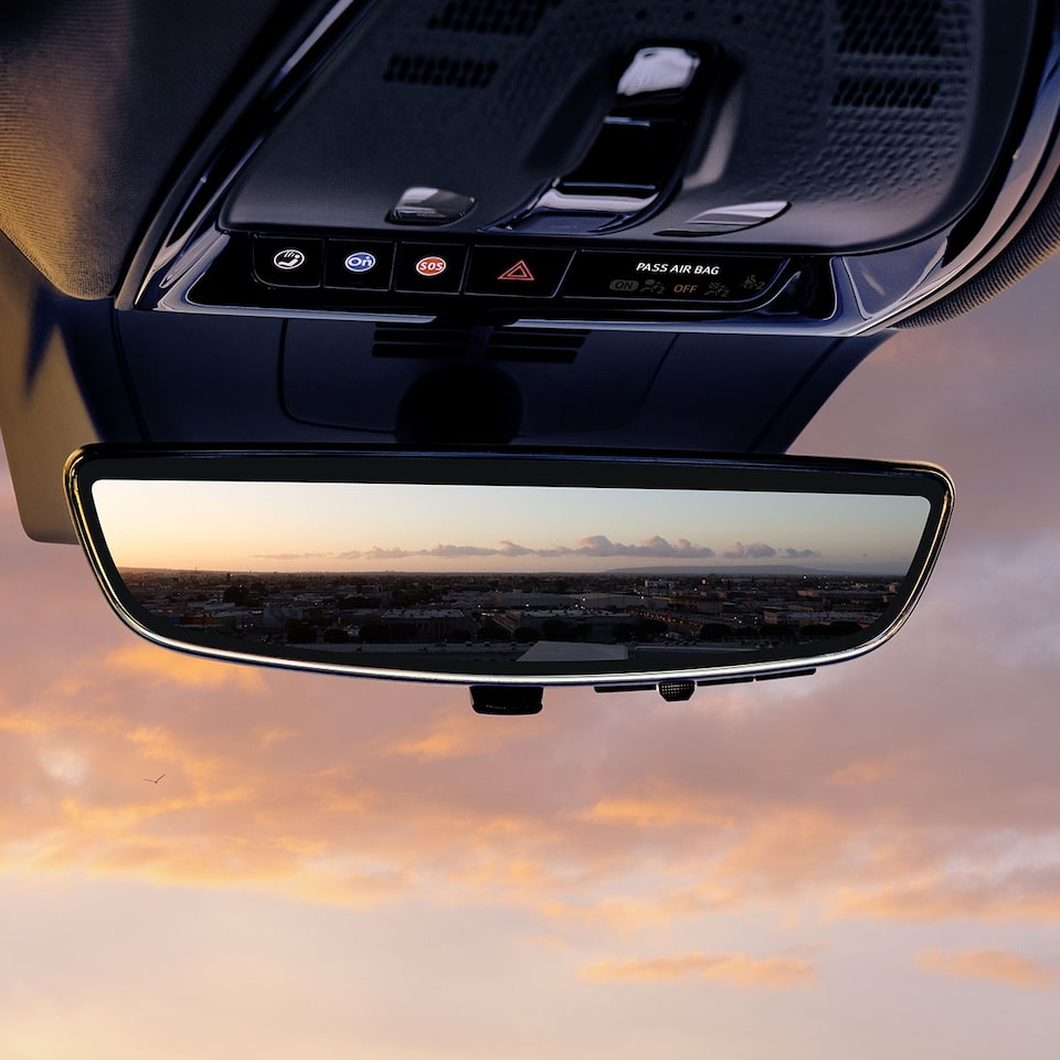 Close up view of the rear view mirror on the 2025 Cadillac OPTIQ electric SUV.