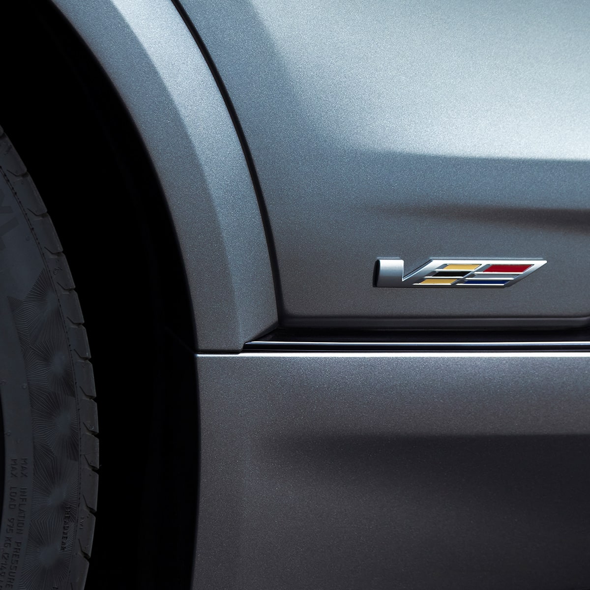 Close up view of the V-series logo etched on the exterior of the 2026 Cadillac LYRIQ-V.