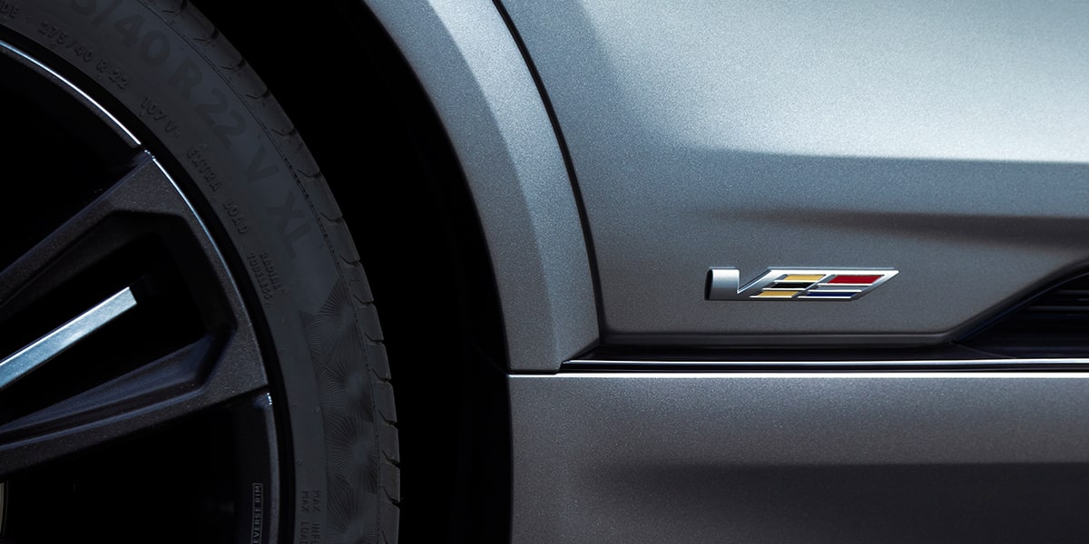 Close up view of the V-series badge etched on the exterior of the 2026 Cadillac LYRIQ-V.