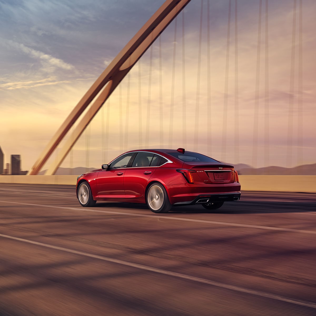 Scenic shot of the 2025 Cadillac CT5 crossing a bridge.