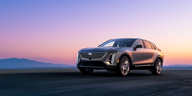 Front view of the Cadillac LYRIQ driving on the road.