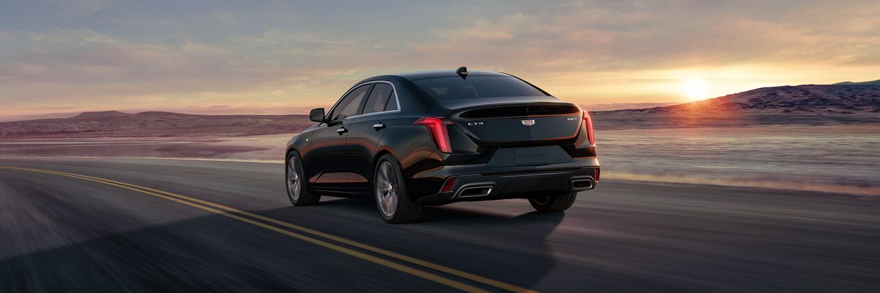 Front profile view of the 2024 Cadillac CT4 driving on the road.
