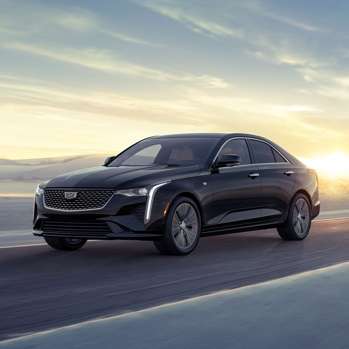 Front profile view of the 2024 CT4 driving down the road.