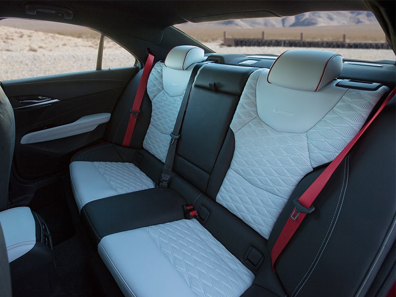 Torch Red seat belts on the seats of the 2025 Cadillac CT4-V luxury sports sedan.