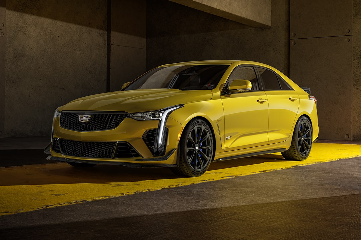 2025 Cadillac CT4-V luxury sports sedan parked alone in a dimly-lit setting.