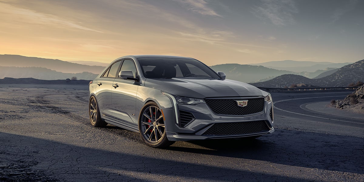 2025 Cadillac CT4-V luxury sports sedan driving durin sunrise.