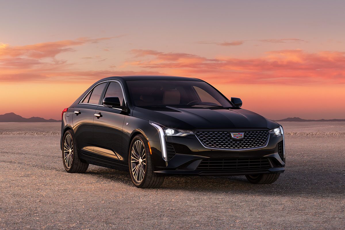 2025 Cadillac CT4 luxury sedan parked alone outside during sunset.