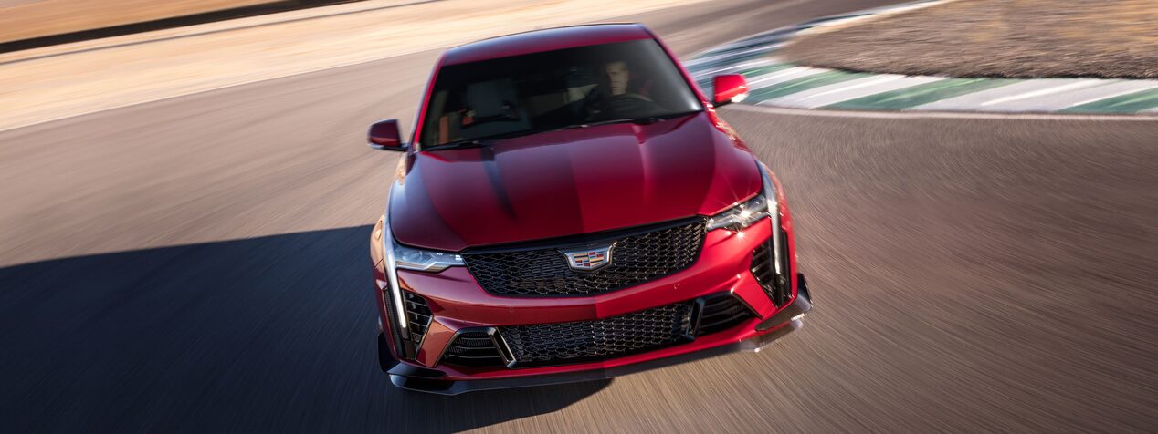Front view of the 2023 Cadillac CT4-V driving on the road.