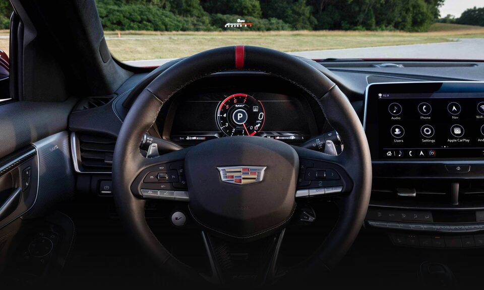 2023 Cadillac CT5-V front interior featuring the steering wheel and head-up display.