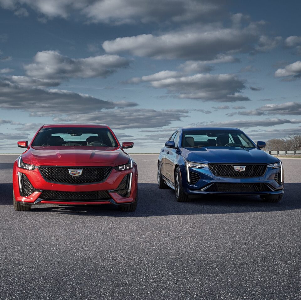 2022 Cadillac CT4-V Blackwing and 2022 Cadillac CT5-V Blackwing driving together.