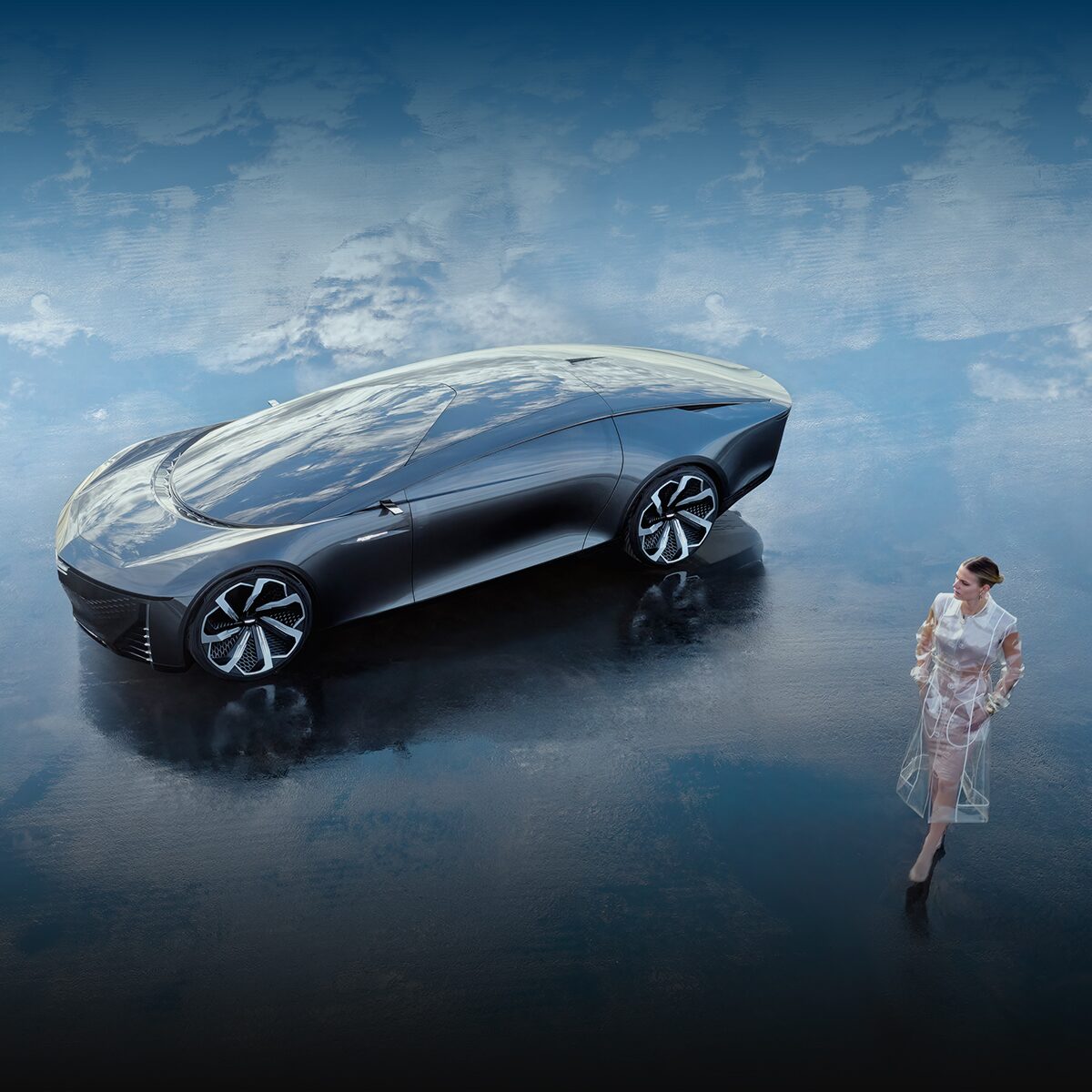 A Cadillac Concept Vehicle parked outdoors as a person passes by.
