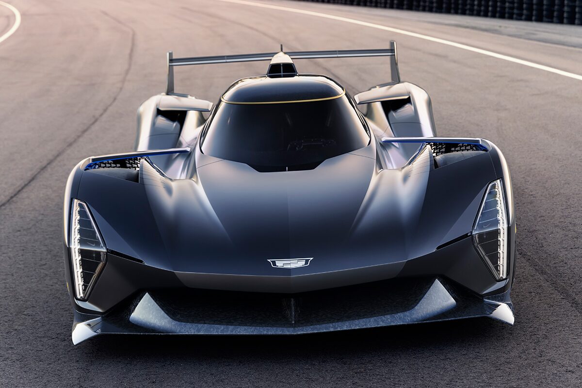 Front view of a Cadillac GTP Hypercar driving on the road.