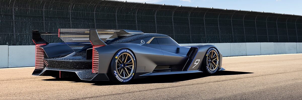 Back-side view of Cadillac GTP Hypercar driving on a track.