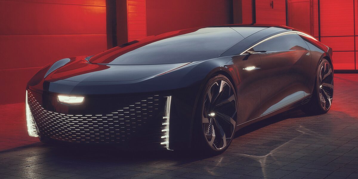 Front-side view of a Cadillac InnerSpace Concept Vehicle parked alone indoors in a dimly lit area.