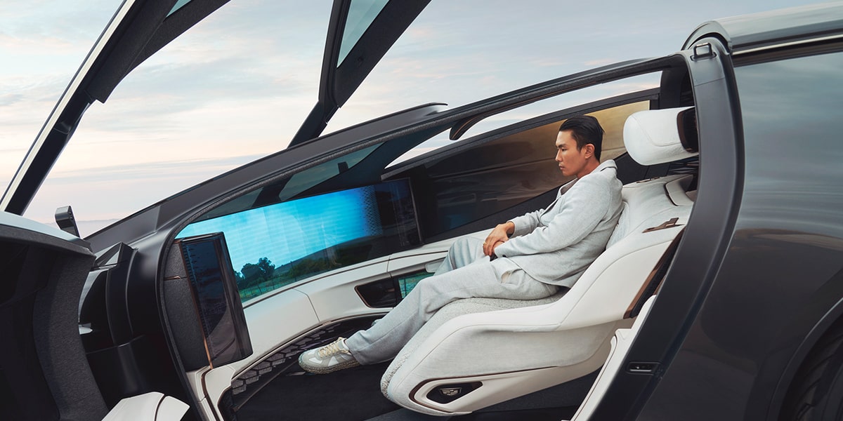 Side view of a person seated comfortably inside a Cadillac InnerSpace Concept Vehicle.
