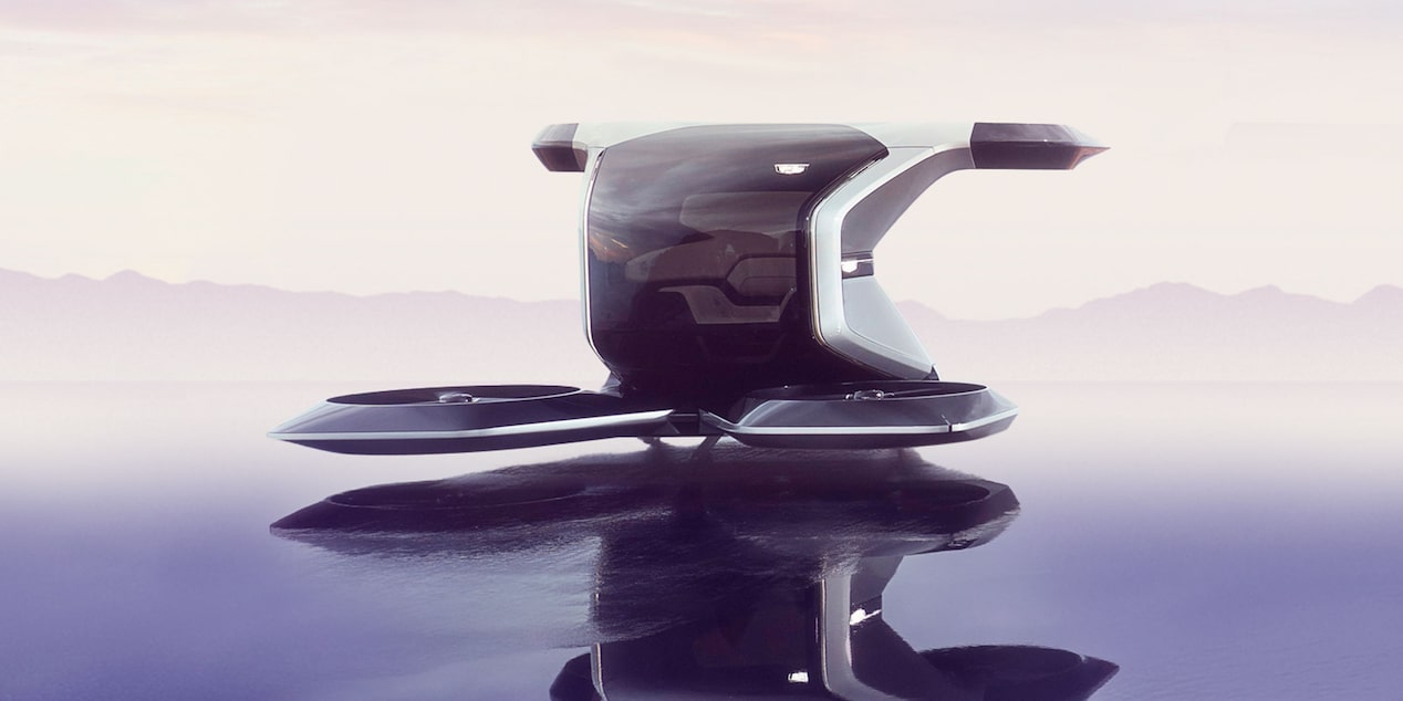Front-side view of a Cadillac PersonalSpace Autonomous EV parked outdoors.
