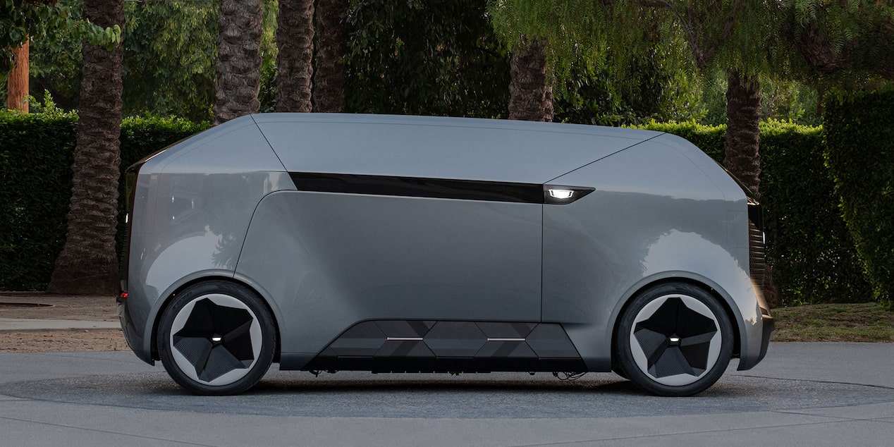 Side view of a Cadillac SocialSpace Concept Vehicle parked outdoors.