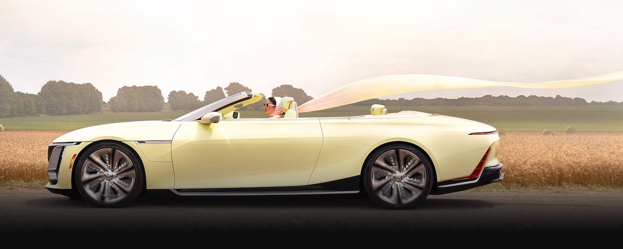 Side view of the Cadillac SOLLEI Concept Vehicle parked outdoors on a sunny day.