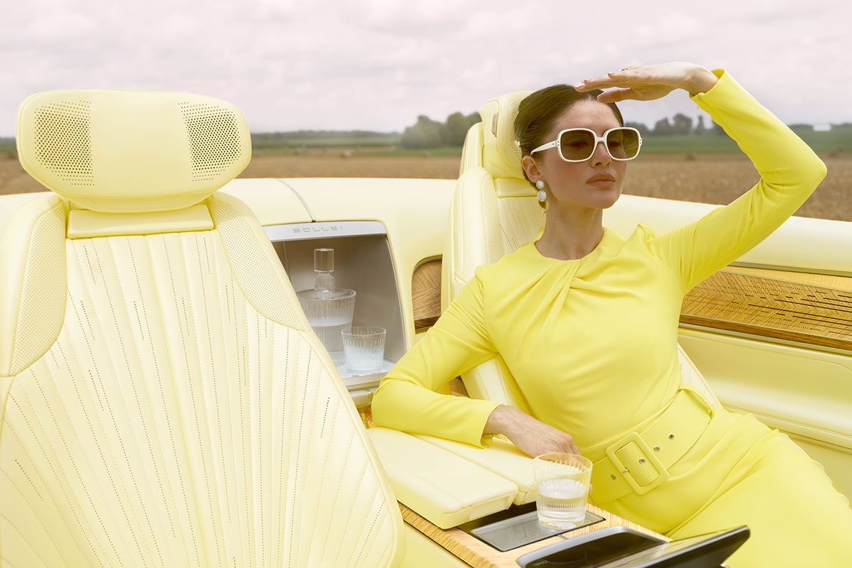 A person seated comfortably at the rear passenger's seat of the Cadillac SOLLEI Concept Vehicle.