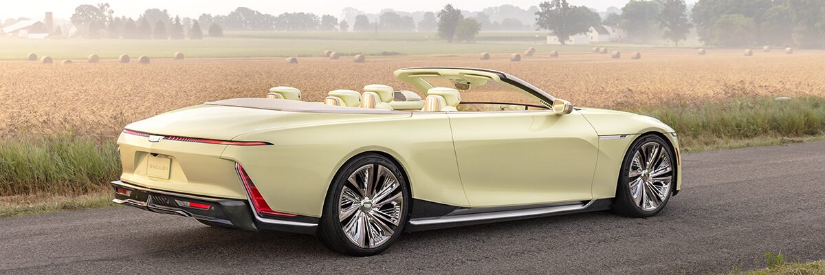 Back-side view of the Cadillac SOLLEI Concept Vehicle parked alone outdoors on a sunny day.