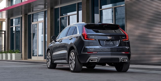 Rear view of the 2022 Cadillac XT4 parked on the road.