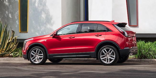 Side-view profile of the 2022 Cadillac XT4 parked outside.