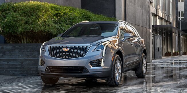 2022 Cadillac XT5 driving on a wet road.