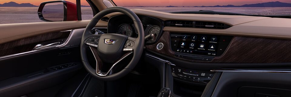 Steering wheel and centre console overview of the 2024 Cadillac XT6.