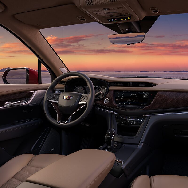 Front interior view of the 2024 Cadillac XT6 at sunset.