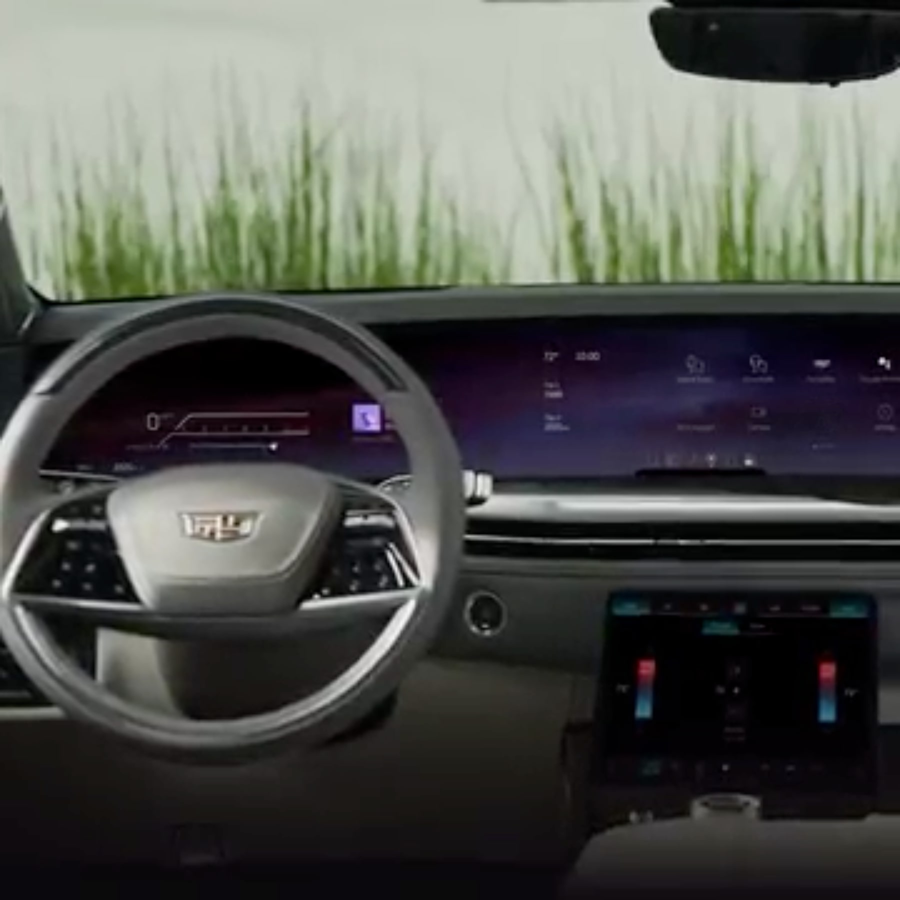 Driver's view of the steering wheel and front interiors of the 2026 Cadillac Escalade.