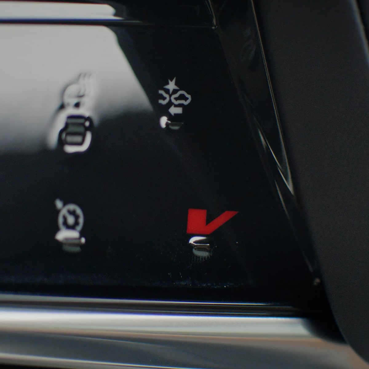 Close up view of the V-mode button inside the 2026 Cadillac Escalade-V.