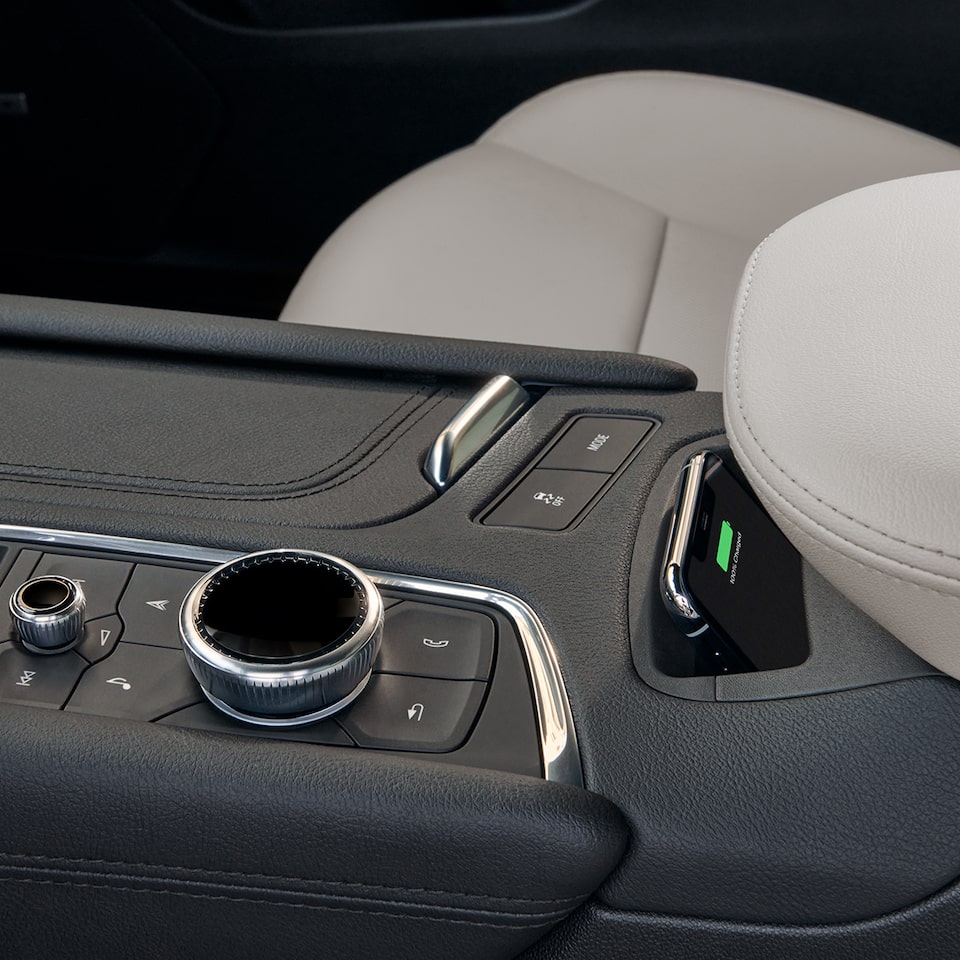 Close up view of the wireless charging feature on the 2026 Cadillac XT5 luxury SUV.
