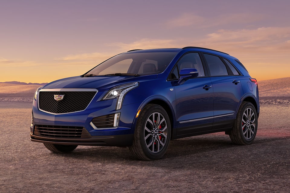 2026 Cadillac XT5 luxury SUV parked alone during sunrise.