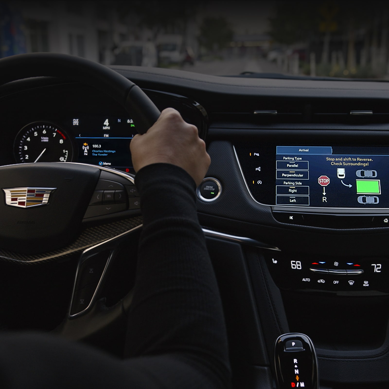 First-person view of a person holding the steering wheel on the 2026 Cadillac XT5 luxury SUV.