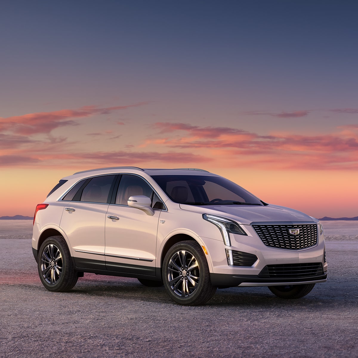2026 Cadillac XT5 luxury SUV parked outdoors during sunrise.