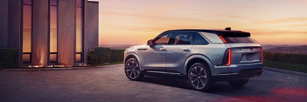 2025 Cadillac Escalade IQ electric suv parked alone during sundown.