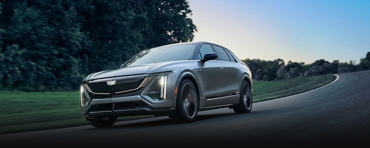 2026 Cadillac LYRIQ-V driving alone on the road.