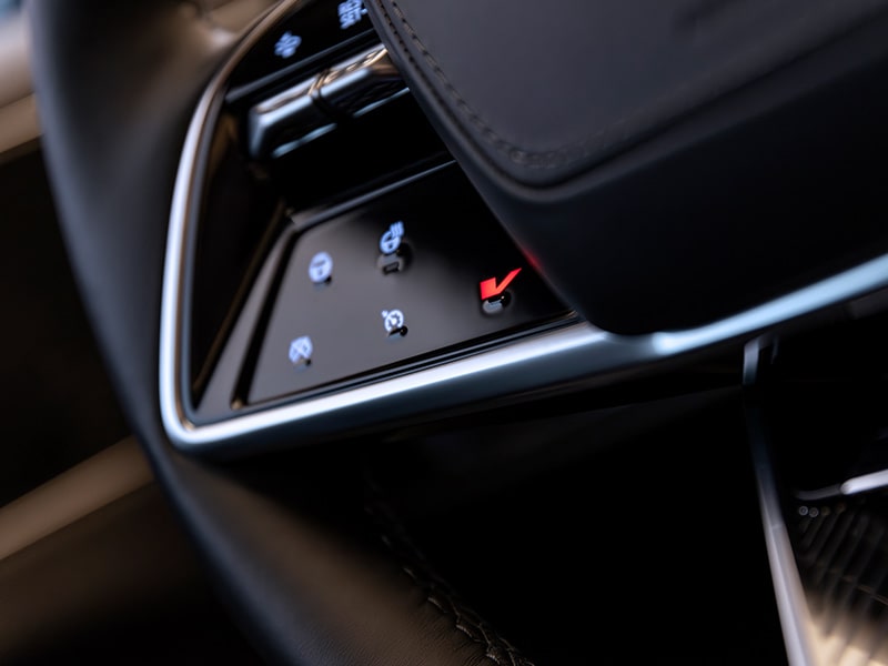Close up view of the Velocity Max button on the steering wheel of the 2026 Cadillac LYRIQ-V.