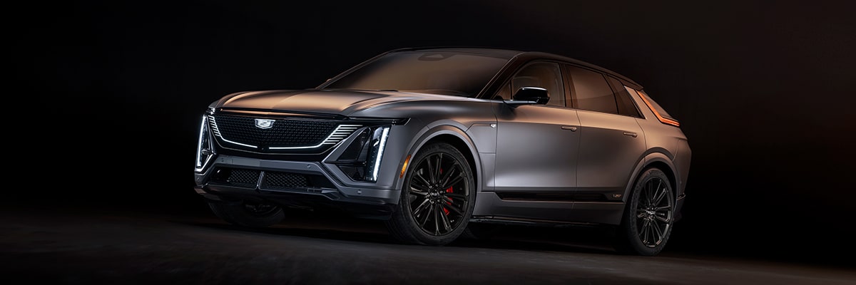Front-side view of the 2026 Cadillac LYRIQ-V parked in a dimly lit area.