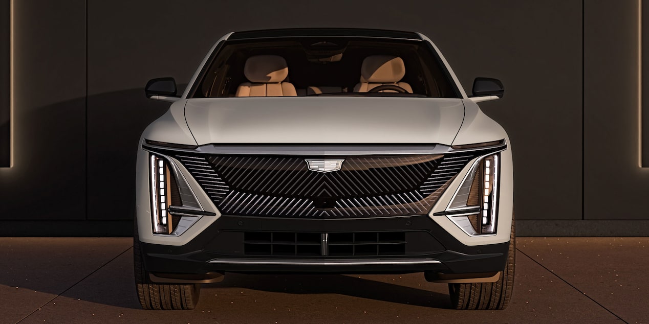 Front view of the 2026 Cadillac LYRIQ Luxury trim parked outside a garage.