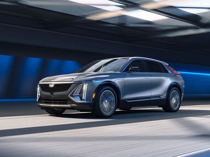 A 2026 Cadillac LYRIQ driving fast on a tunnel.
