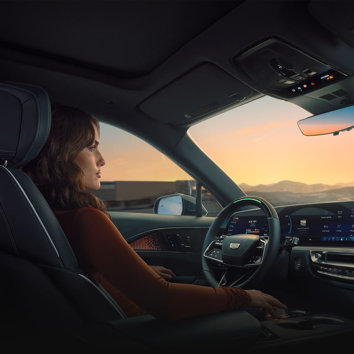 Front passenger's view of a person driving the 2026 Cadillac LYRIQ.