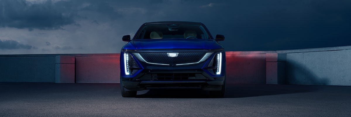 Front view of the 2026 Cadillac LYRIQ parked on the rooftop at night.