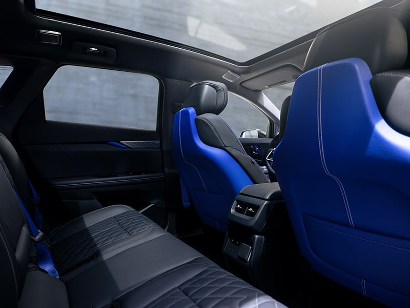 Interior shot showing front seats and center console of the OPTIQ-V.