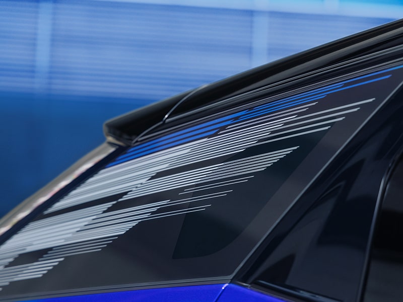 A Mondrian-patterned graphic adorning the glass of the 2026 Cadillac OPTIQ-V electric SUV.