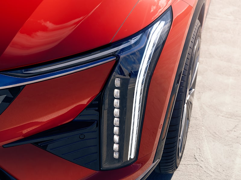Close up view of the string LED headlamps on the 2026 Cadillac OPTIQ electric SUV.
